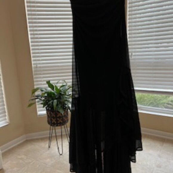 Black formal girls dress with multiple layers of sheer ruffles at the bottom. - Picture 4 of 7